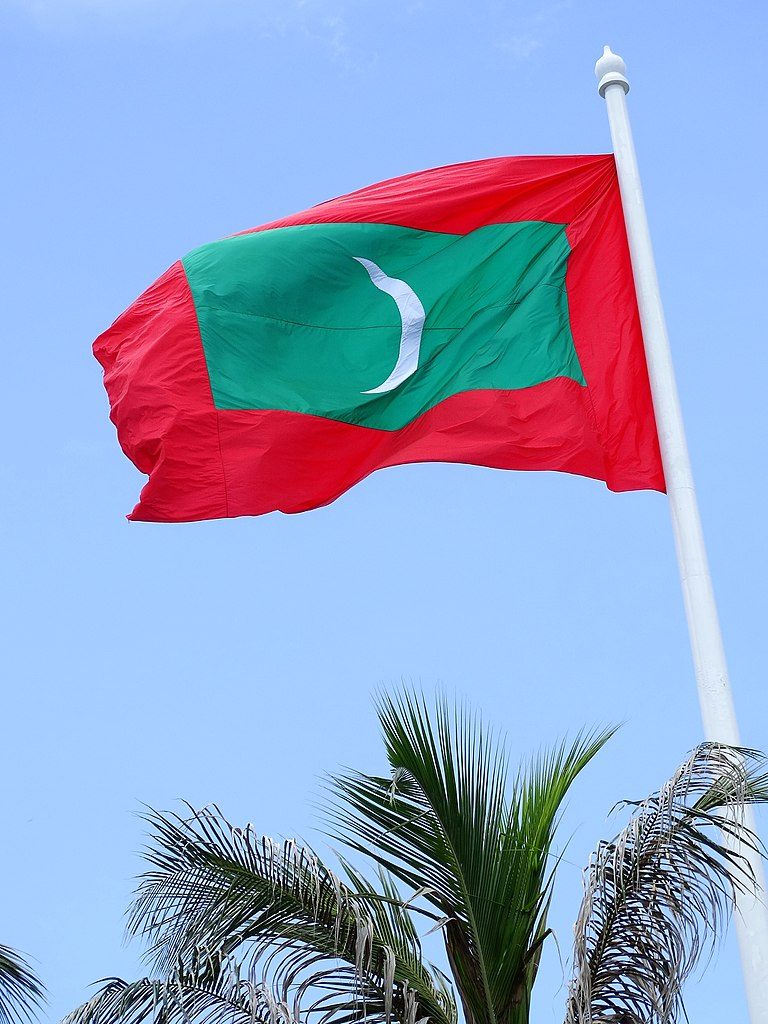 Maldives | Image credit: Adam Jones from Kelowna, BC, Canada, Maldives Flag Flying - Male - Maldives (14064519789) , CC BY-SA 2.0